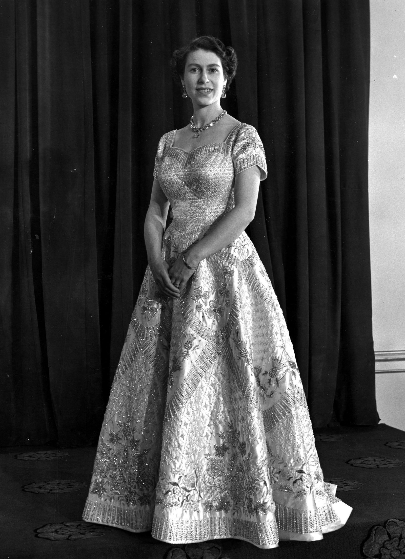 Queen Elizabeth II in her Norman Hartnell dress at her coronation in 1953.
