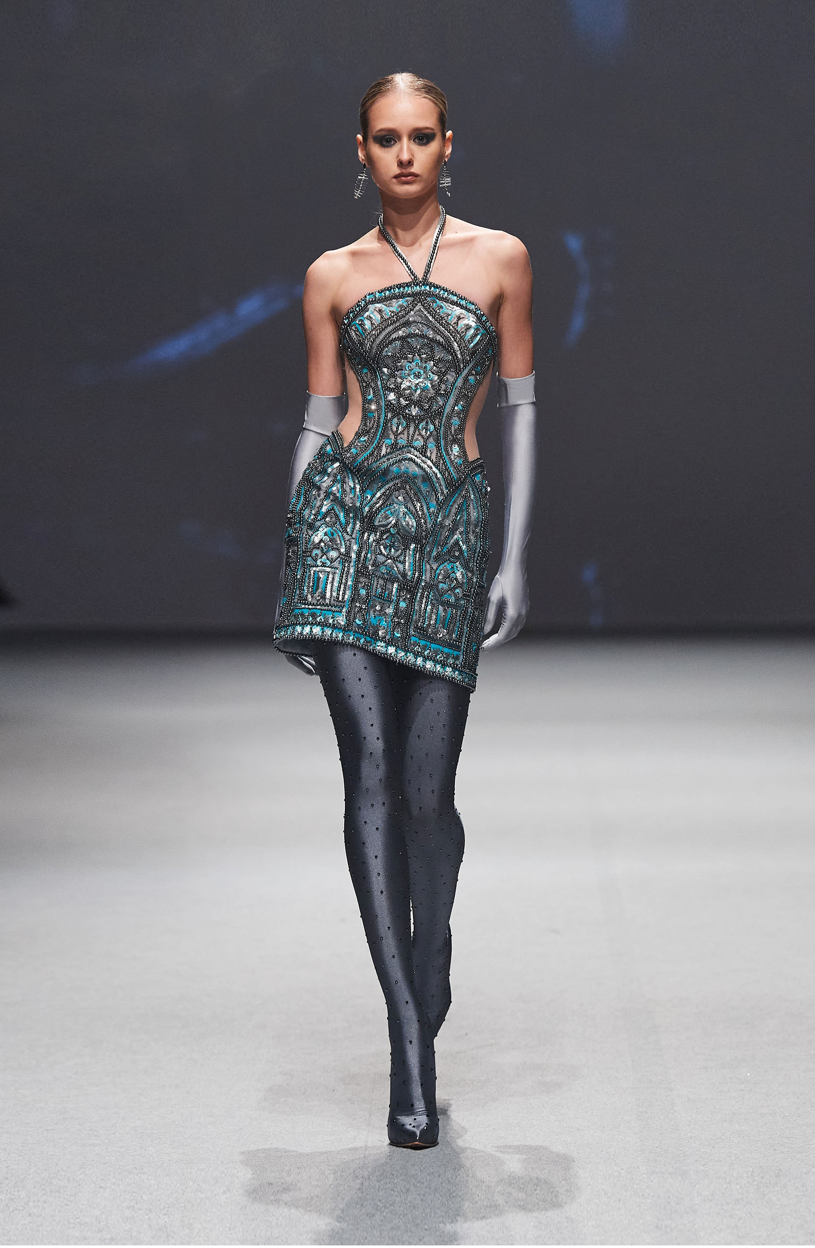 Michael Cinco runway look turquoise dress with silver gloves