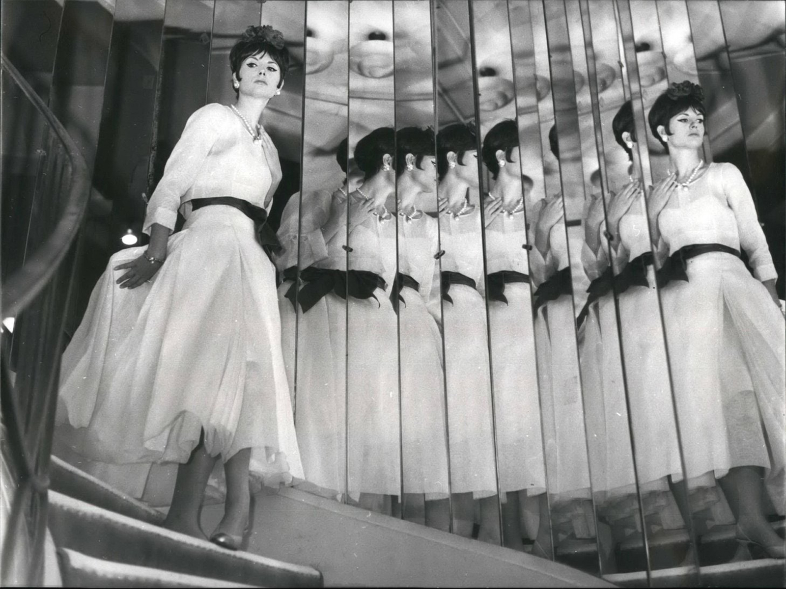 A model in a 1963 Chanel design, descending the stairs of the couturière’s atelier. ZUMA Press, Inc. / Alamy Stock Photo