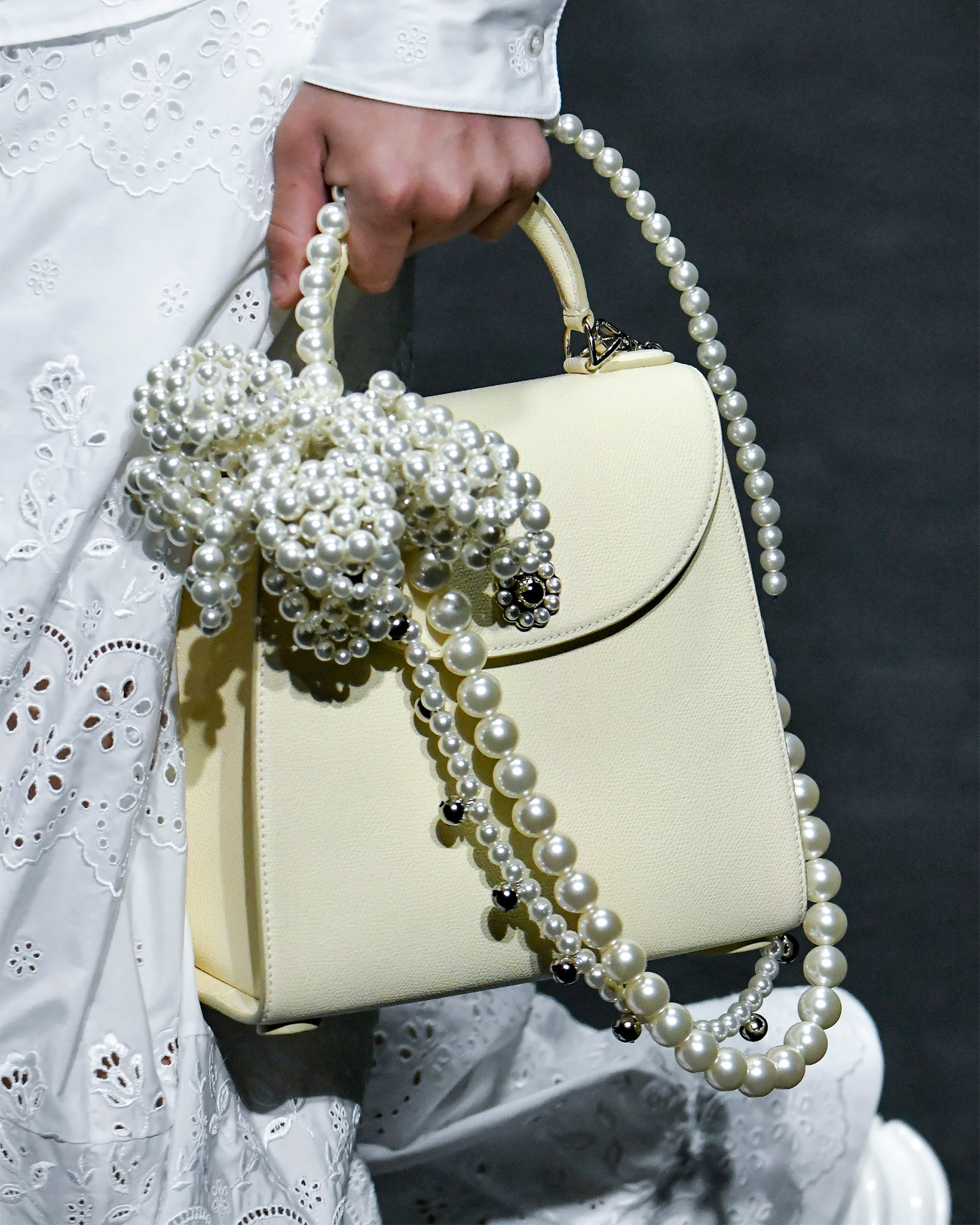 Lime hand bag with pearl details by Simone Rocha.