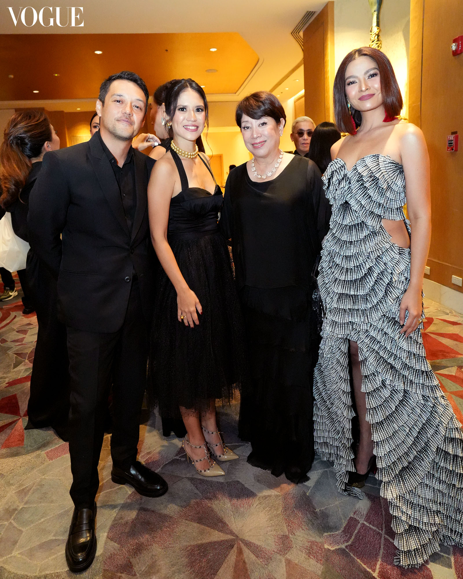 Martin De Guzman, Marion Branellec De Guzman, Doris Magsaysay Ho, and Rissa Mananquil Trillo posing at the photo wall at the Vogue Philippines Gala 2023