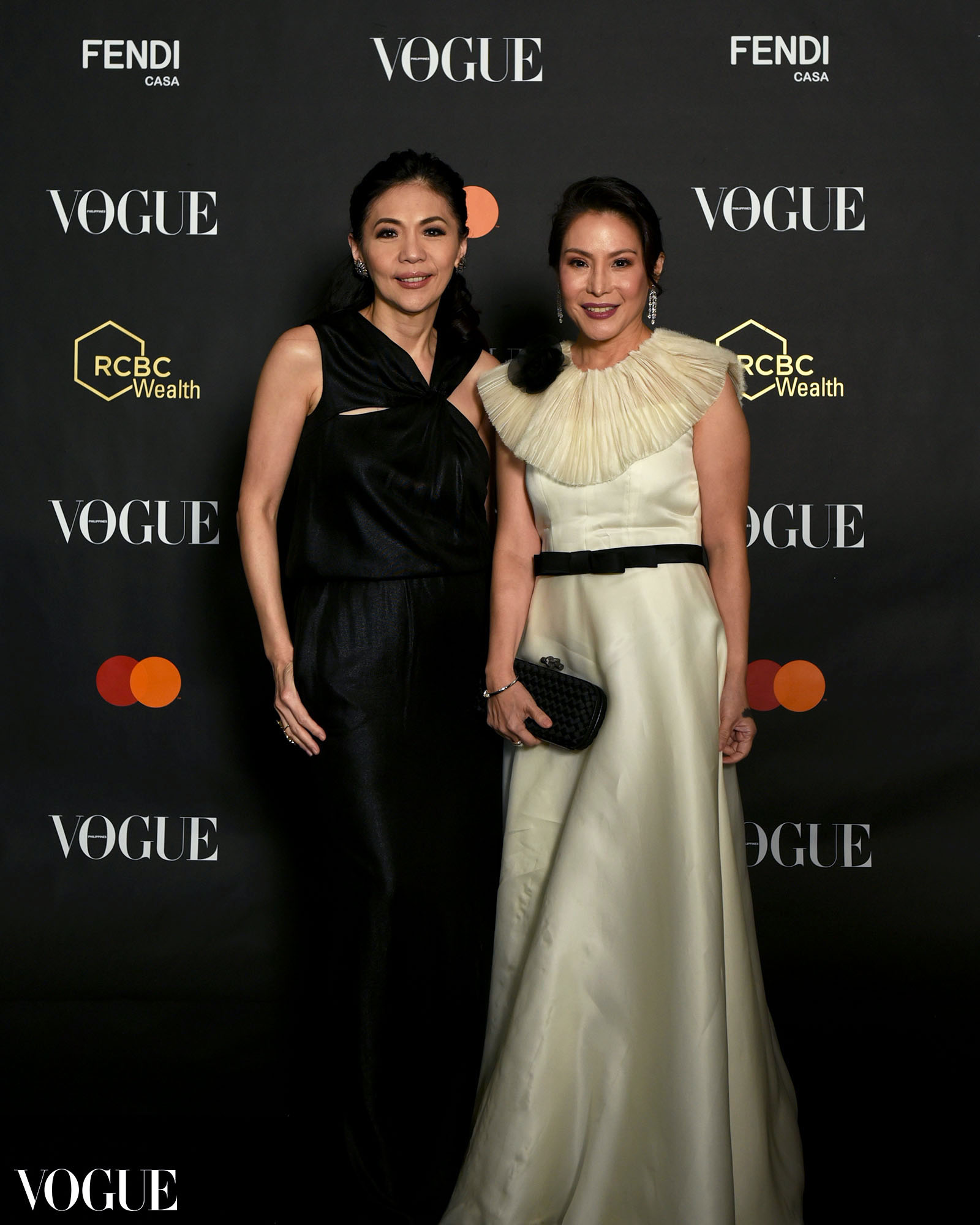 Kaye Tinga and Ana Lorenzana De Ocampo posing at the photo wall at the Vogue Philippines Gala 2023