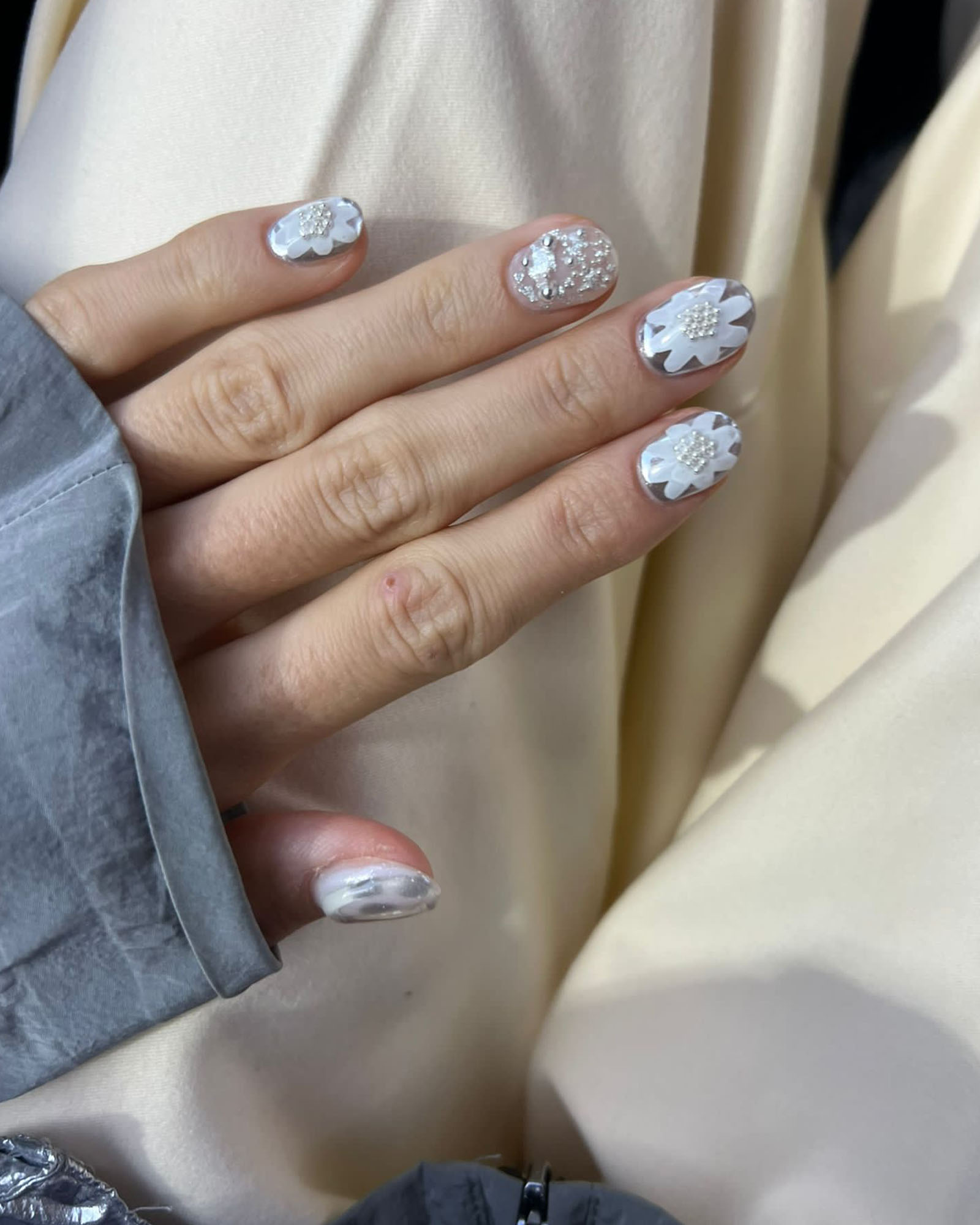Law’s pearl-adorned nails at the Here:re nail salon.