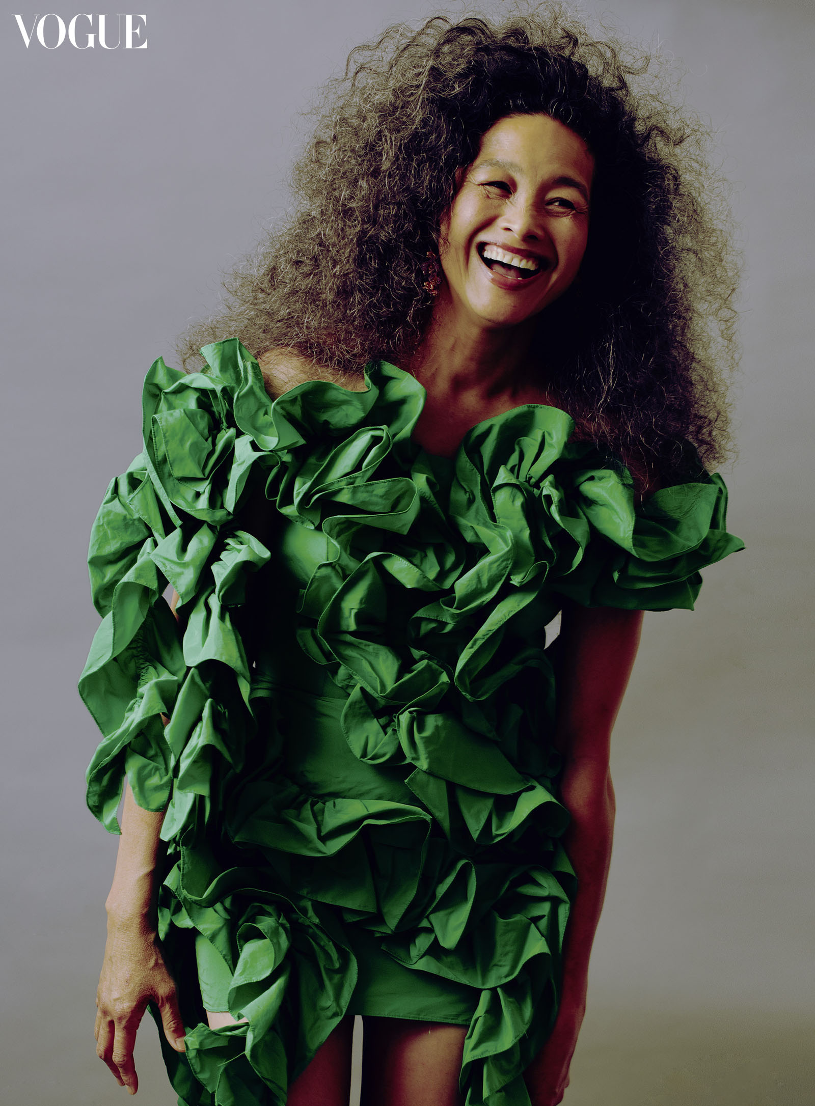 Ankvas green ruffle dress and Levian orchid earrings photographed by Harold Julian.