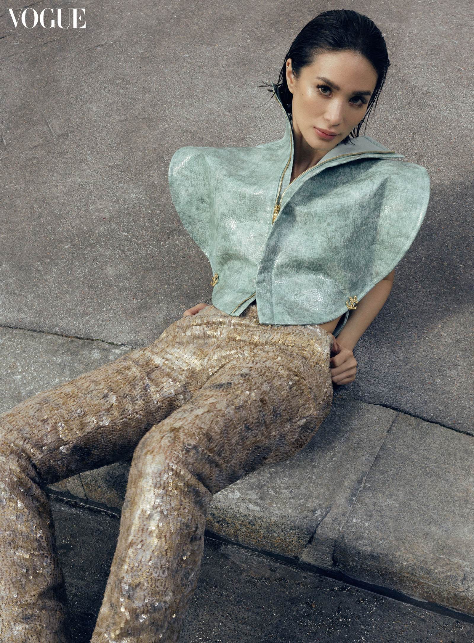 Heart Evangelista wearing a Louis Vuitton shagreen circle blouse and embellished trousers with a building pattern.