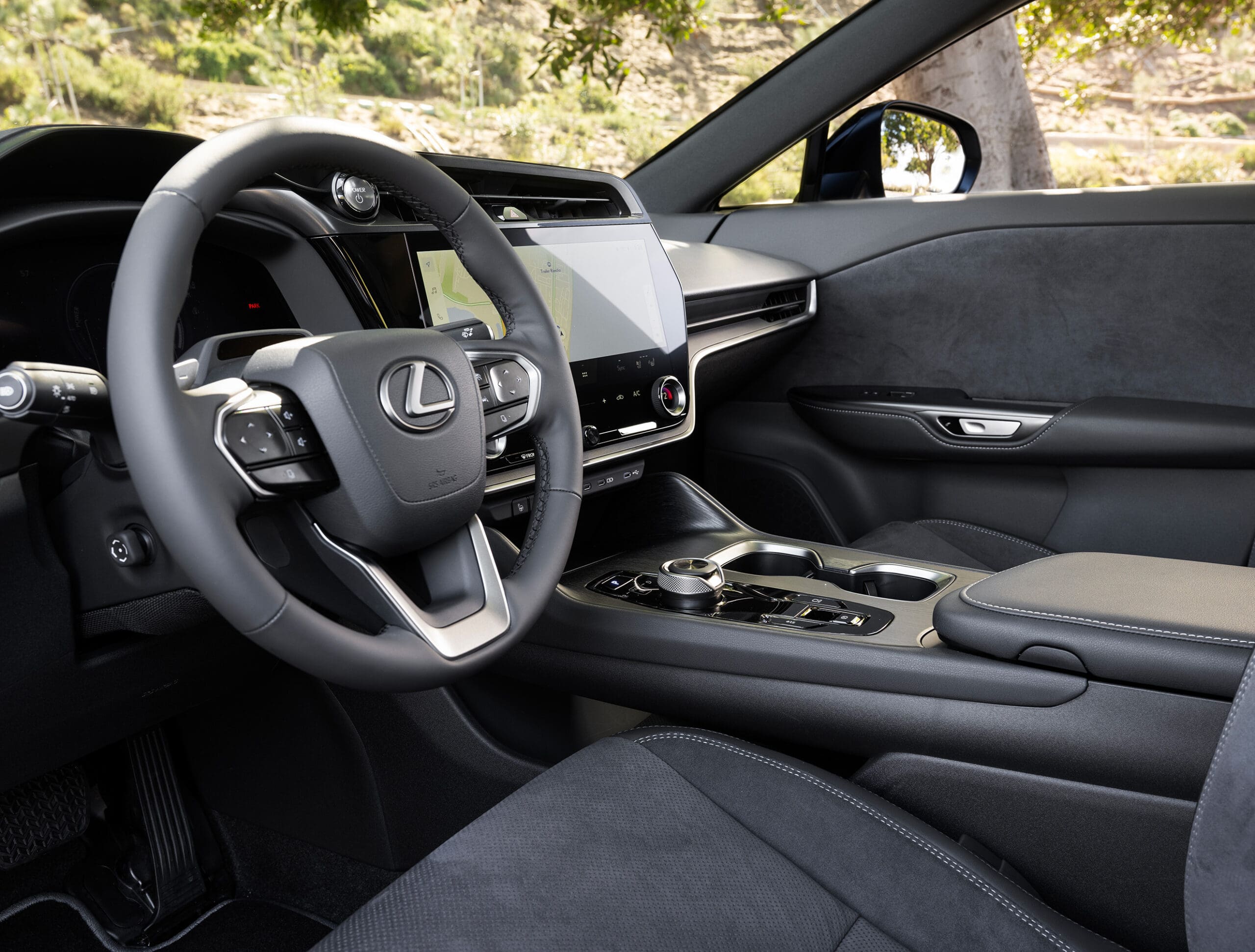 The black, gray, and silver interiors of the Lexus RZ