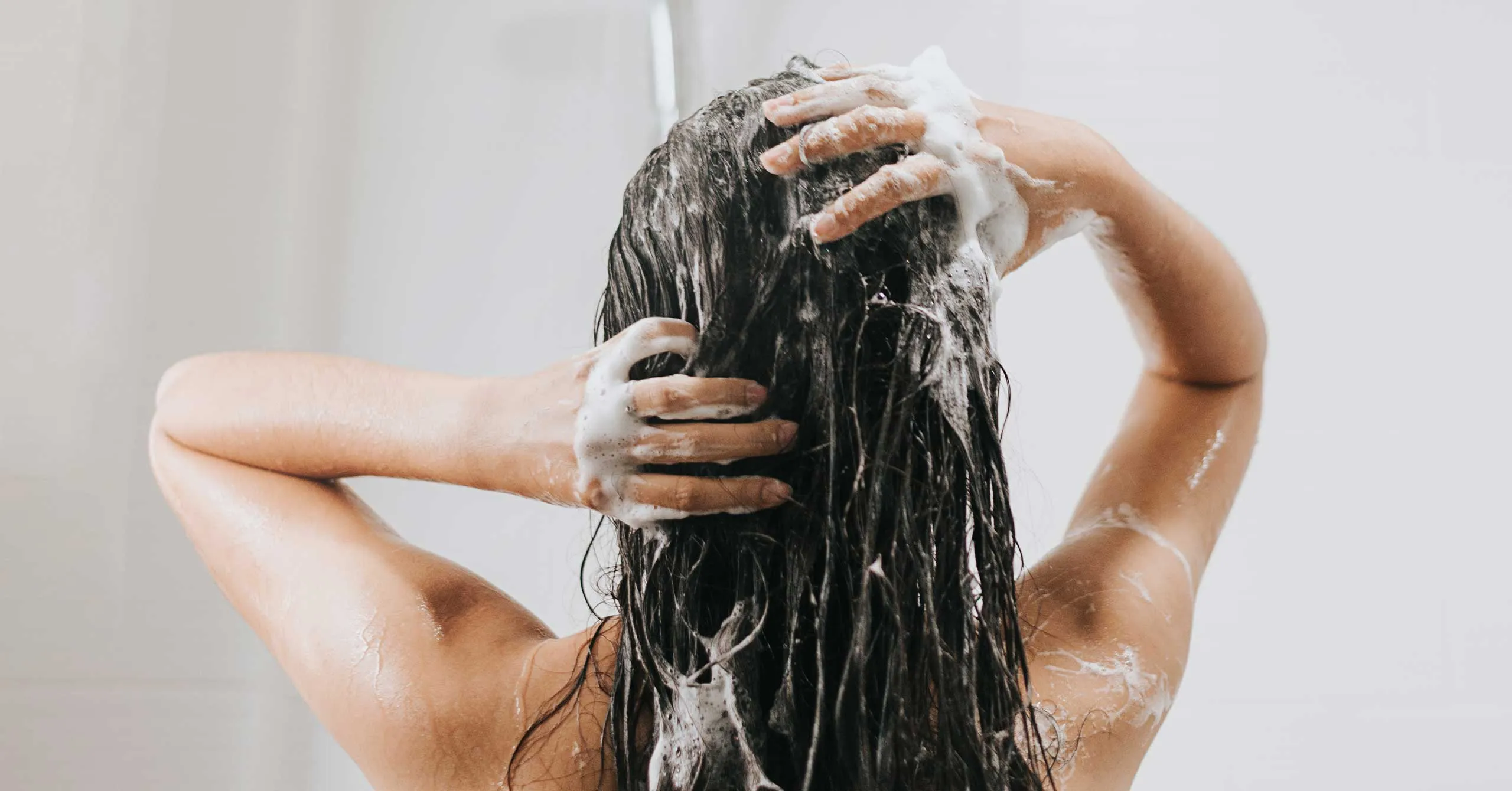 Hairstylist demonstrating Japanese hair-washing technique